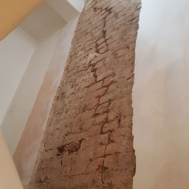 Stair wall cracked, this was stitched and replastered