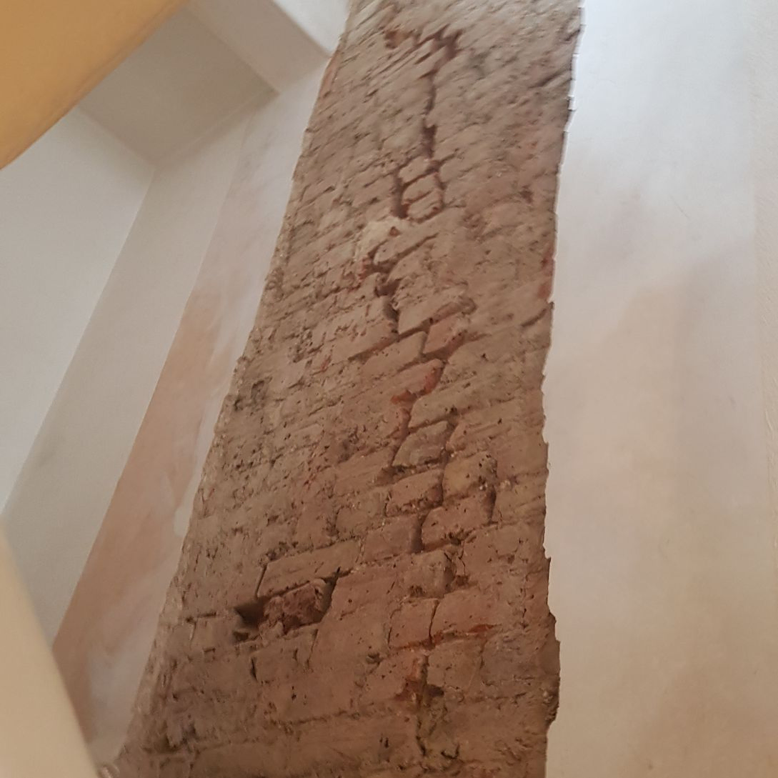 Stair wall cracked, this was stitched and replastered