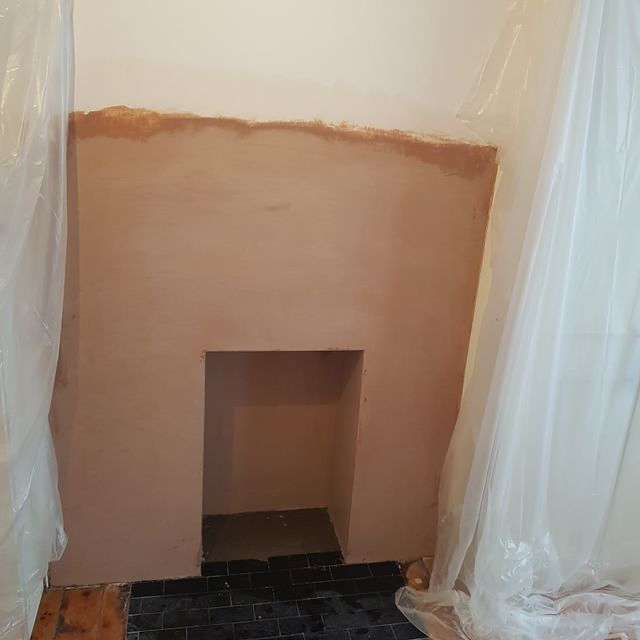 fireplace removed & boxed in & plastered